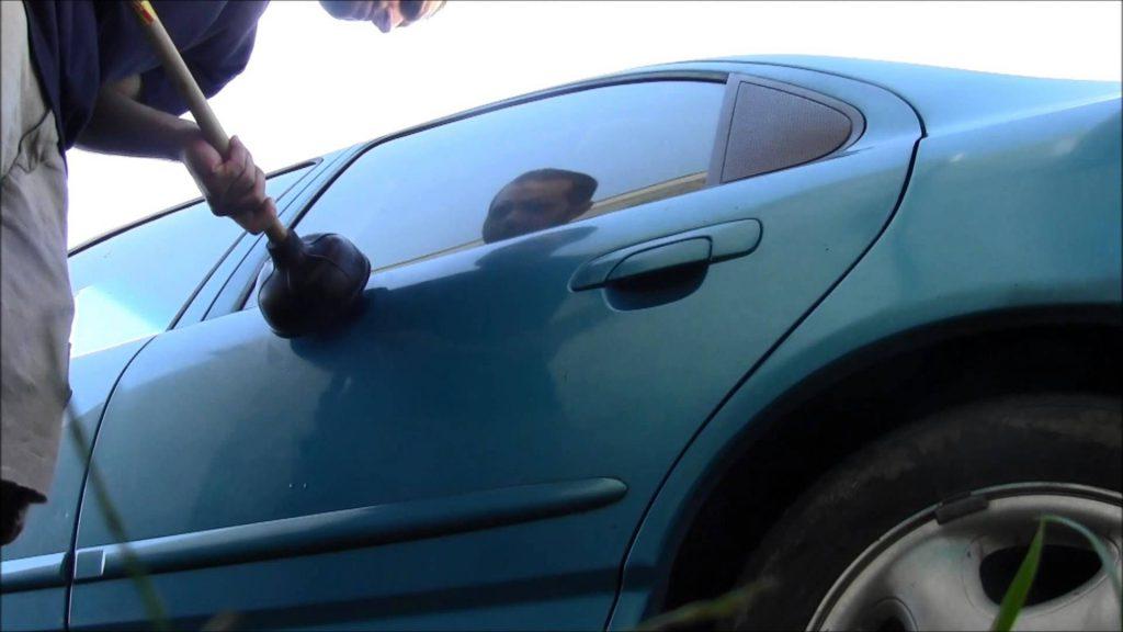 How To Fix A Dent In A Car Door With A Plunger