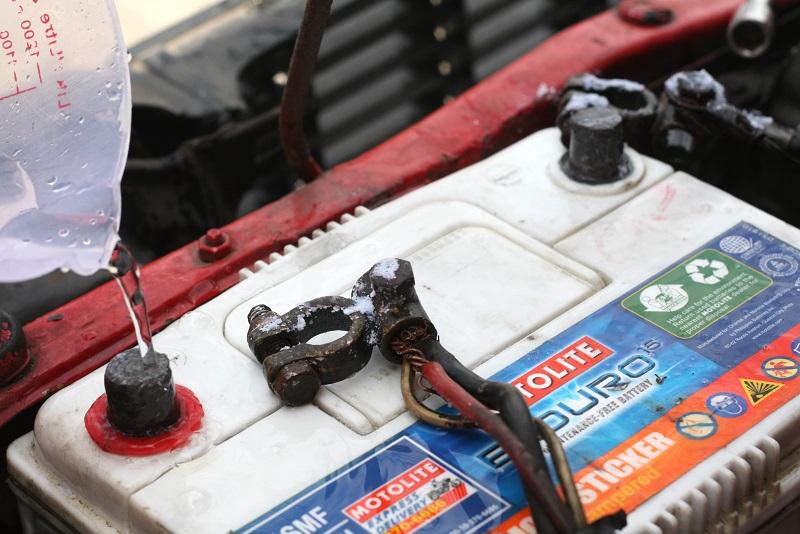 Cleaning the terminals. car battery maintenance tips