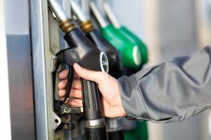 Return fuel nozzle to its position Hand holding fuel nozzle
