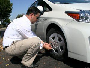 A quick check before driving is essential Drivers checking his car