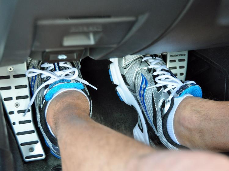 You have to release the clutch slowly. drive manual car uphill without rolling back