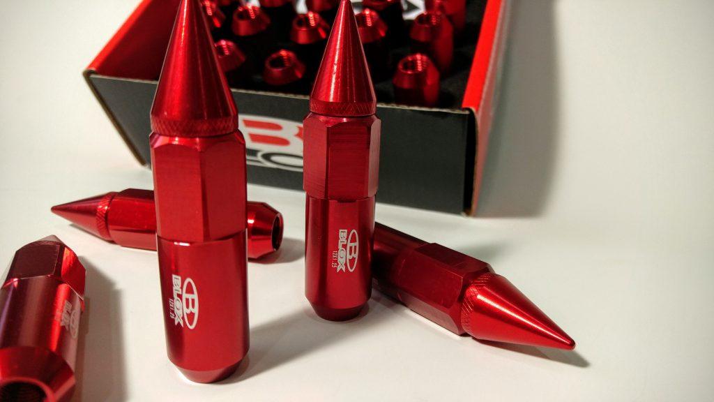 Lug nut covers acts as spikes on truck wheels Poking spikes on truck wheels
