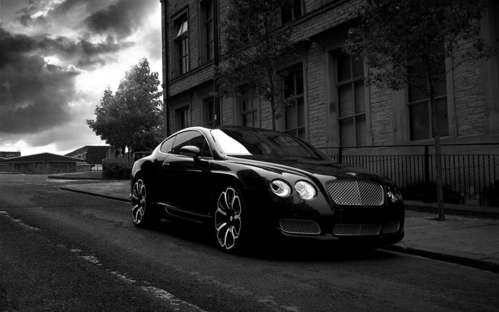 Black does not reflect light as well as other colors Black car on road