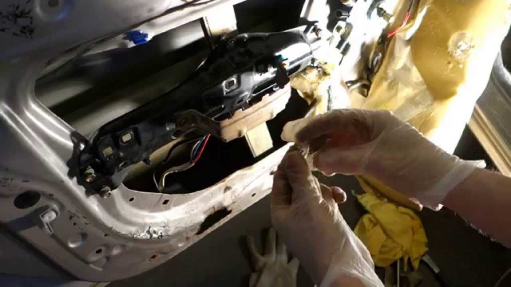 It is a Crucial Step in Replacing Car Door Locks Effortlessly Unscrew the Handle Using a Screwdriver
