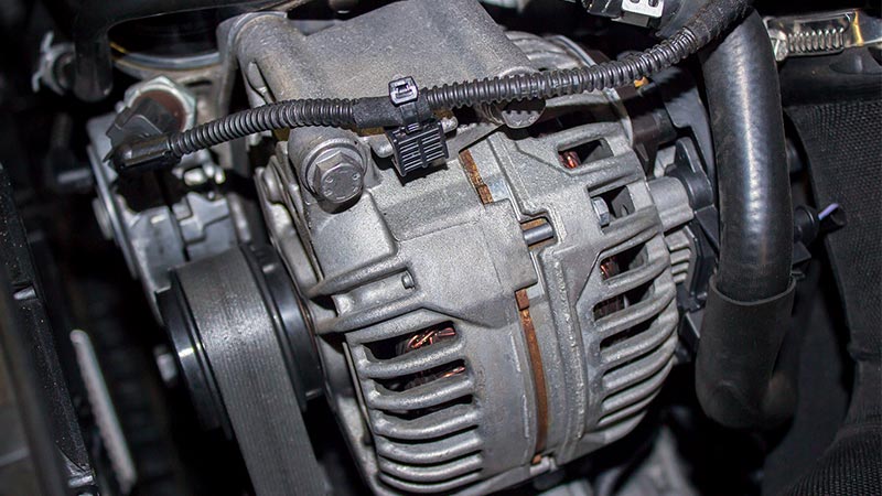 test car alternator with multimeter