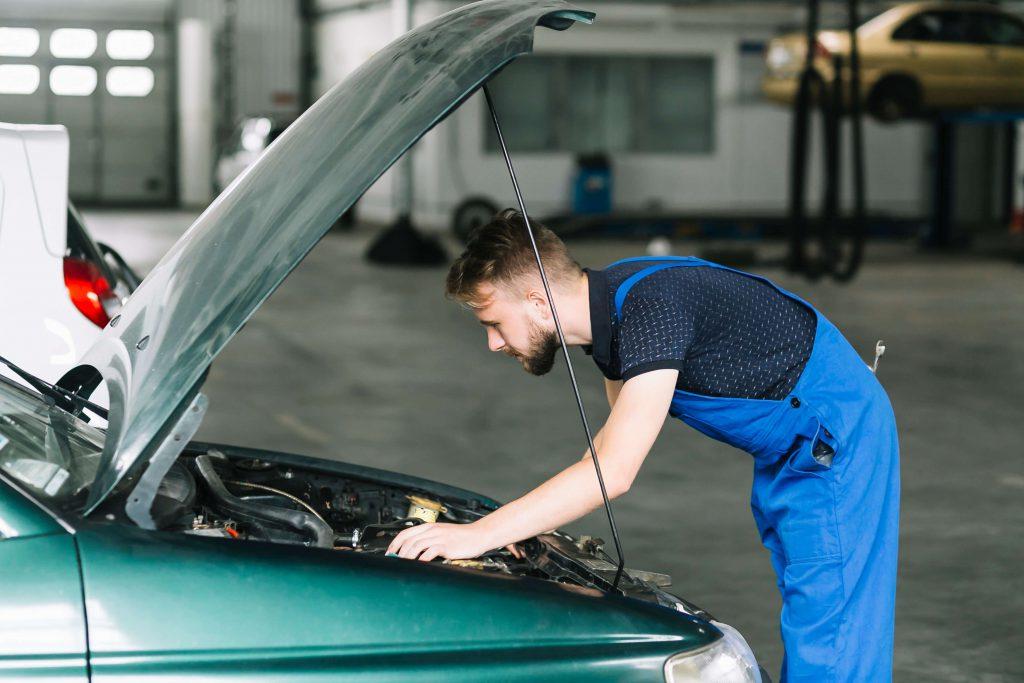 Mechanic working on the Car Worn stem seals