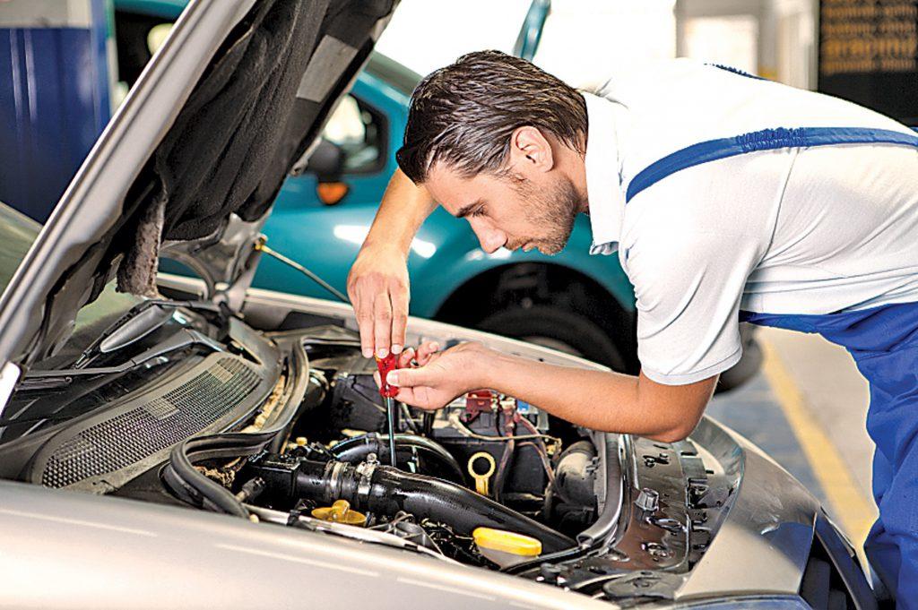 Mechanic Repairing Vehicle How often do you change a cambelt