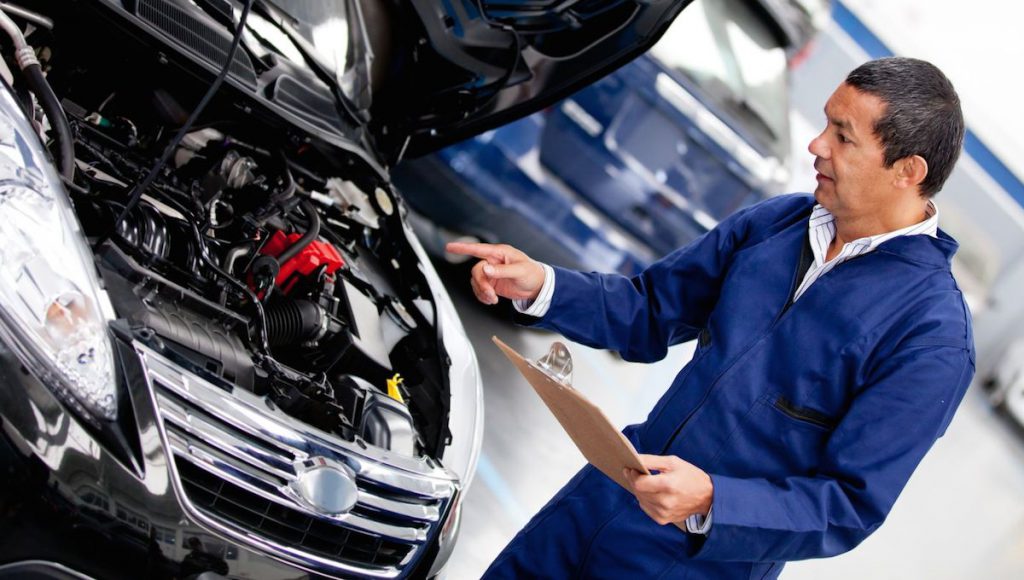 Professional Checking the Car Fuel Injector