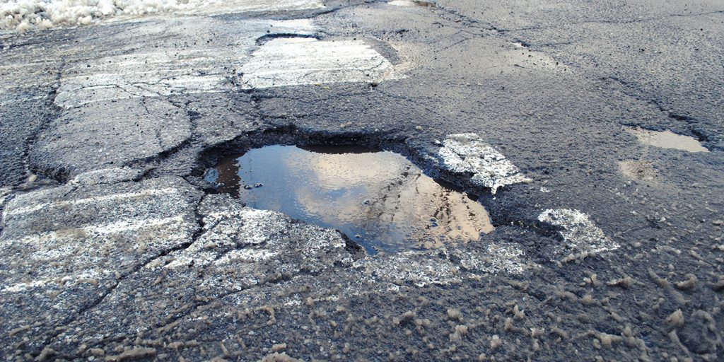 can hitting a pothole damage your car